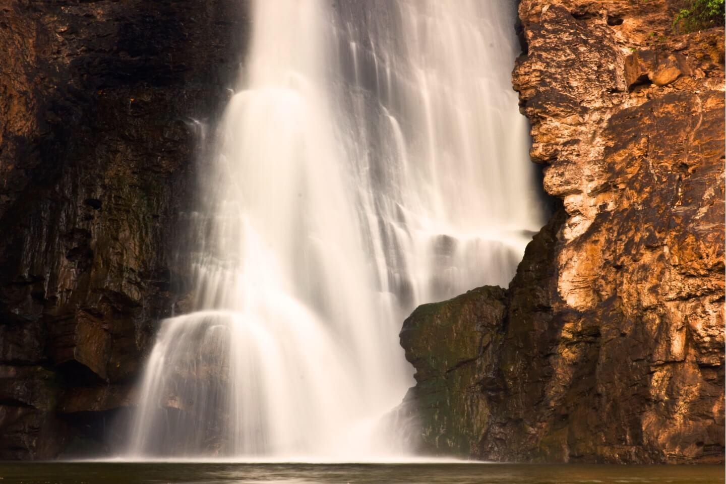 5. Arvalem Caves & Waterfall – Hidden History Spot